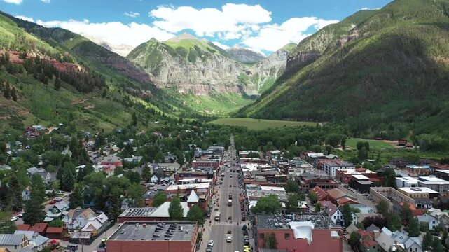Flying over Main Street towards mountains in Telluride Colorado