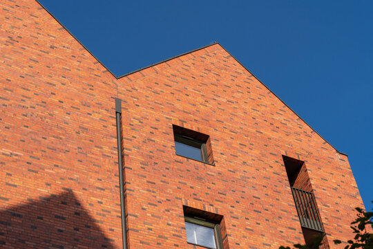 Contemporary brick facade on blue clear sky