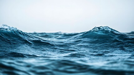 Fototapeta premium Gentle fluid waves in a calm ocean, illustrating the graceful movement of water