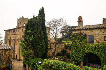 Fototapeta premium Església de Sant Pere church in the historic centre of Pals, old town on a hill with medieval Romanesque buildings, Plaça de l'Església, Begur, Girona, Catalonia, Costa Brava, Spain