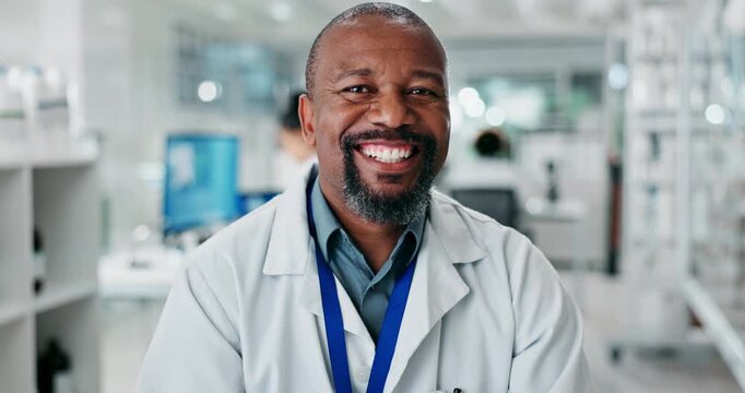 Face, happy man and scientist in lab on computer for research, pharma or healthcare innovation. Portrait, science and smile of medical doctor, professional or chemist on tech for medicine development