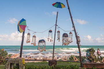 Porto de Galinhas, Pernambuco, Brazil. Decorations made of shells, coral and coconuts are displayed...