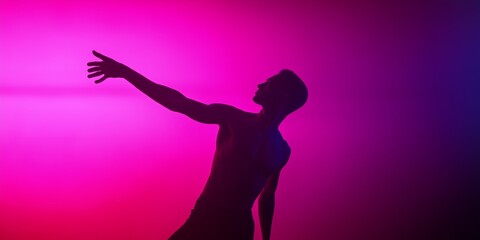A man is silhouetted against a pink background. He is reaching out with his hand. The image has a mood of loneliness and longing