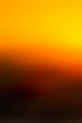 Gradient background:  Sunset Symphony: captivating beauty of a golden hour sunset in this vibrant gradient. The seamless transition from deep amber to soft yellow evokes a sense of tranquility and won