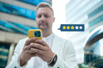 Customer satisfaction experience concept. Businessman using mobile phone giving 3 star icon and excellent for feedback review satisfaction service. rating very impressed. High quality photo