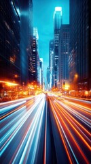 Fototapeta premium A timelapse of a bustling city street at night with streaks of car lights and pedestrians moving, creating a dynamic and energetic urban atmosphere