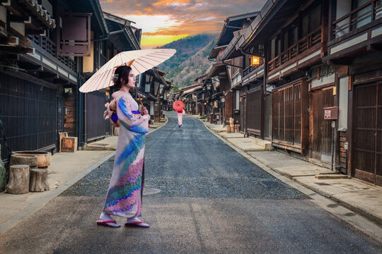 Asian girl in a traditional Japanese kimono visits Naraijuku, a famous travel destination city in Japan.