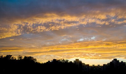 Sky in a fire sunset, beautiful sunrise or sunset sky over the sity background