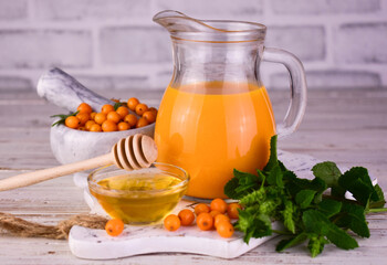 Juice from sea buckthorn berries. Vitamin drink.
