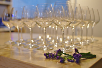 Elegant Wine Glasses on Wooden Table with Floral Accent