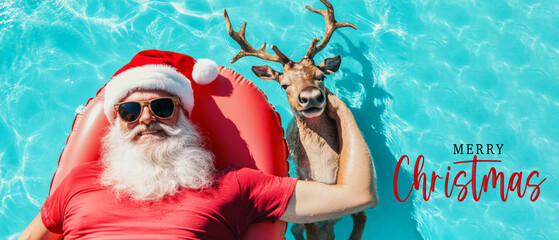 Merry Christmas holiday vacation winter greeting card with text - Cool hipster Santa Claus with sunglasses and reindeer  lying and relaxing on air mattress in swimming pool