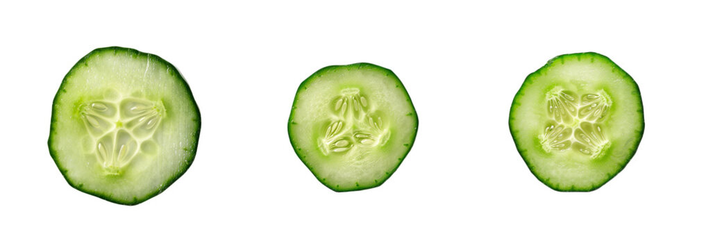 Three fresh cucumber slices isolated on a transparent background, perfect for summer salad recipes and healthy eating concepts