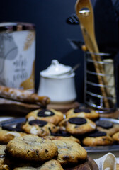 Freshly baked delicious cookies on a blurred kitchen background.