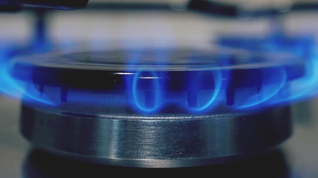 Kitchen stove gas burner, close-up view. Natural or propane gas ignition