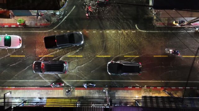 4K Top view of Bangkok street being flooded by heavy rain and storm weather