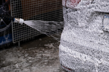 SUV Being Washed at Car Wash