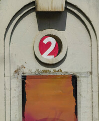 Framed white  Number Two by Concrete Arch: Part of City Bridge Construction. Red and brown.