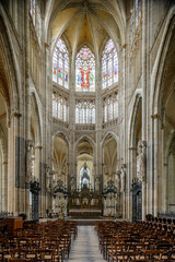 Fototapeta premium ROUEN, NORMANDY, FRANCE - 2024: Saint-Ouen Abbey, interior architectural details, nave and altar