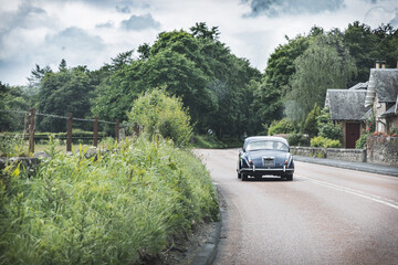 Fototapeta premium Classic Car on a Quaint Scottish Country Road