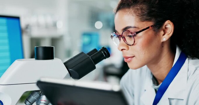 Woman, microscope and analysis in lab tablet, research and live cell imaging with immunologist for recording study. Record, microbial data and innovation investigation, virus specimen and scientist