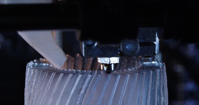 3D printer working. Fused deposition modeling, FDM. 3D printer printing an object from plastic. Automatic three dimensional 3d printer performs plastic. Progressive additive technology for 3d printing