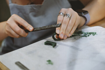jewelry workshop, working with a file
