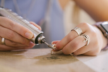 jewelry workshop, close-up of ring grinding