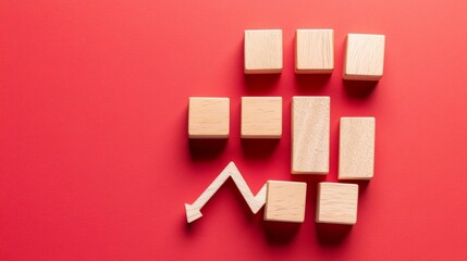 Declining Market Analytics Concept with Wooden Blocks on Red Background. Flat Lay Minimalistic Design.