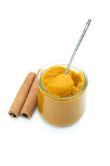 Pumpkin pudding with sweet cream and cinnamon powder isolated on white
