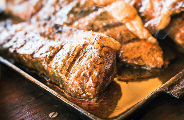 Grilled Picanha, traditional Brazilian beef cut. Meat served on the plate, luxury dinner.