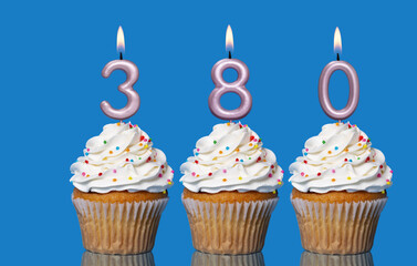 Birthday Cupcakes With Candles Lit Forming The Number 380