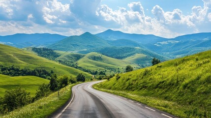 Fototapeta premium Scenic Winding Road Through Lush Green Mountains
