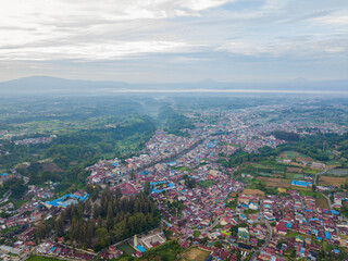 Fototapeta premium Aerial drone view of greenery countryside scenery in Berastagi, North Sumatra, Indonesia. 