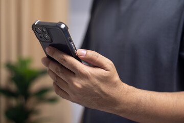 Man's hand using mobile phone, technology, communication, internet