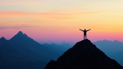 Person standing at a mountain peak at sunrise, arms open wide, symbolizing emotional freedom aEmotional Liberation