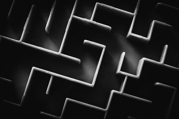 Maze pattern in black and white tones. Find a way out. Complex problems that must be solved.