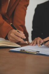 Lawyer, legal advisor, businessman brainstorming information on agreement details Business...