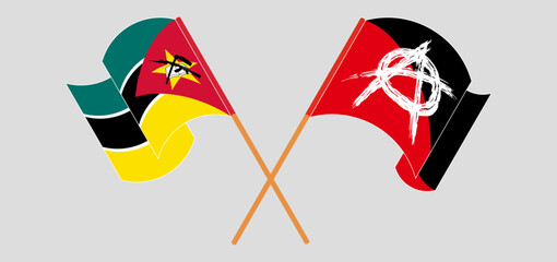 Crossed and waving flags of Mozambique and Anarchy