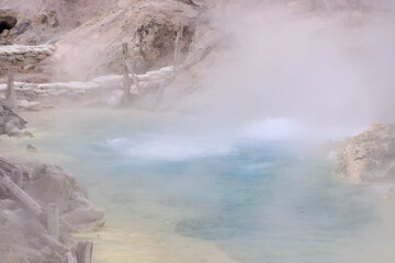 Vibrant Geothermal Pool Amidst Volcanic Terrain in Tamagawa Onsen, Akita, Japan