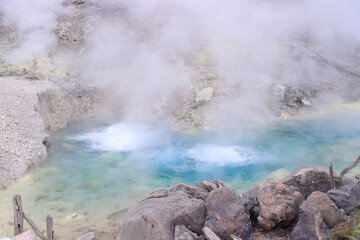Vibrant Geothermal Pool Amidst Volcanic Terrain in Tamagawa Onsen, Akita, Japan