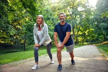 Outdoor Fitness Active Seniors Engaging in Stretching Exercises in Beautiful Nature