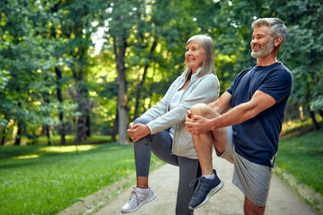 Outdoor Fitness Active Seniors Engaging in Stretching Exercises in Beautiful Nature