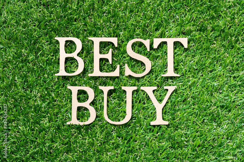 Sticker wood alphabet letter in word best buy on artificial green grass background