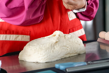 Soft and fluffy dough ready to be shaped into desired bread shape and flavor. Bread making process.