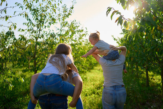      parents ride their children on their backs