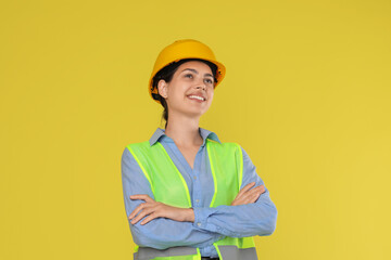 Engineer in hard hat on yellow background