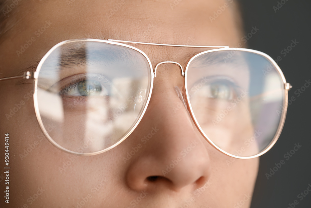 Poster Vision correction. Man wearing glasses on grey background, closeup