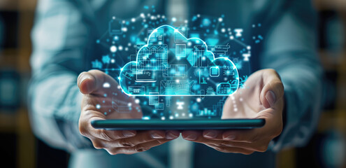 Person holding a tablet with holographic cloud computing icon and digital data streams. Represents cloud technology, data storage, and innovative computing solutions.