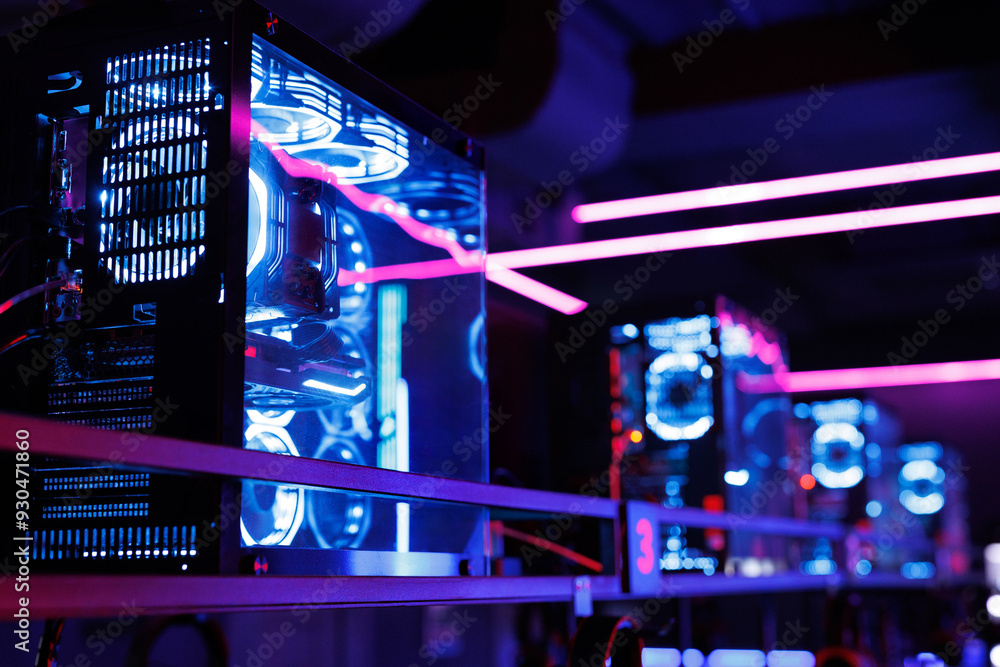 Fototapete professional gaming computer with neon backlight with headset in the computer club for gamers.