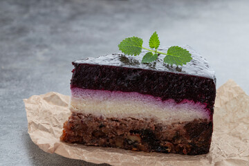 No sugar layered cheese cake made from stevia and berry jelly on gray background